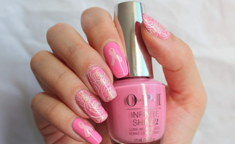Nail art rosa stilizzata, bottiglietta smalto OPI, unghie con disegni floreali