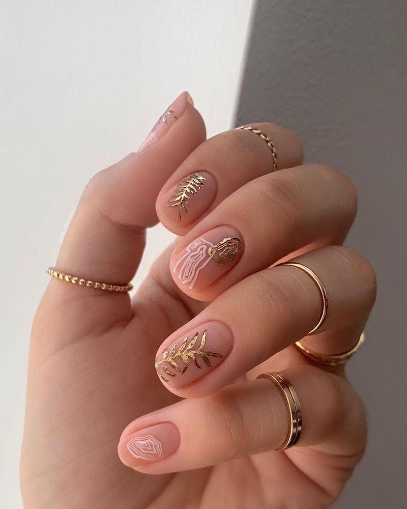 nude nail with floral motifs